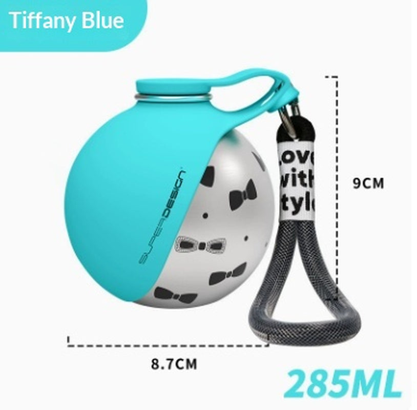 Dog travel water bottle with built-in drinking cup